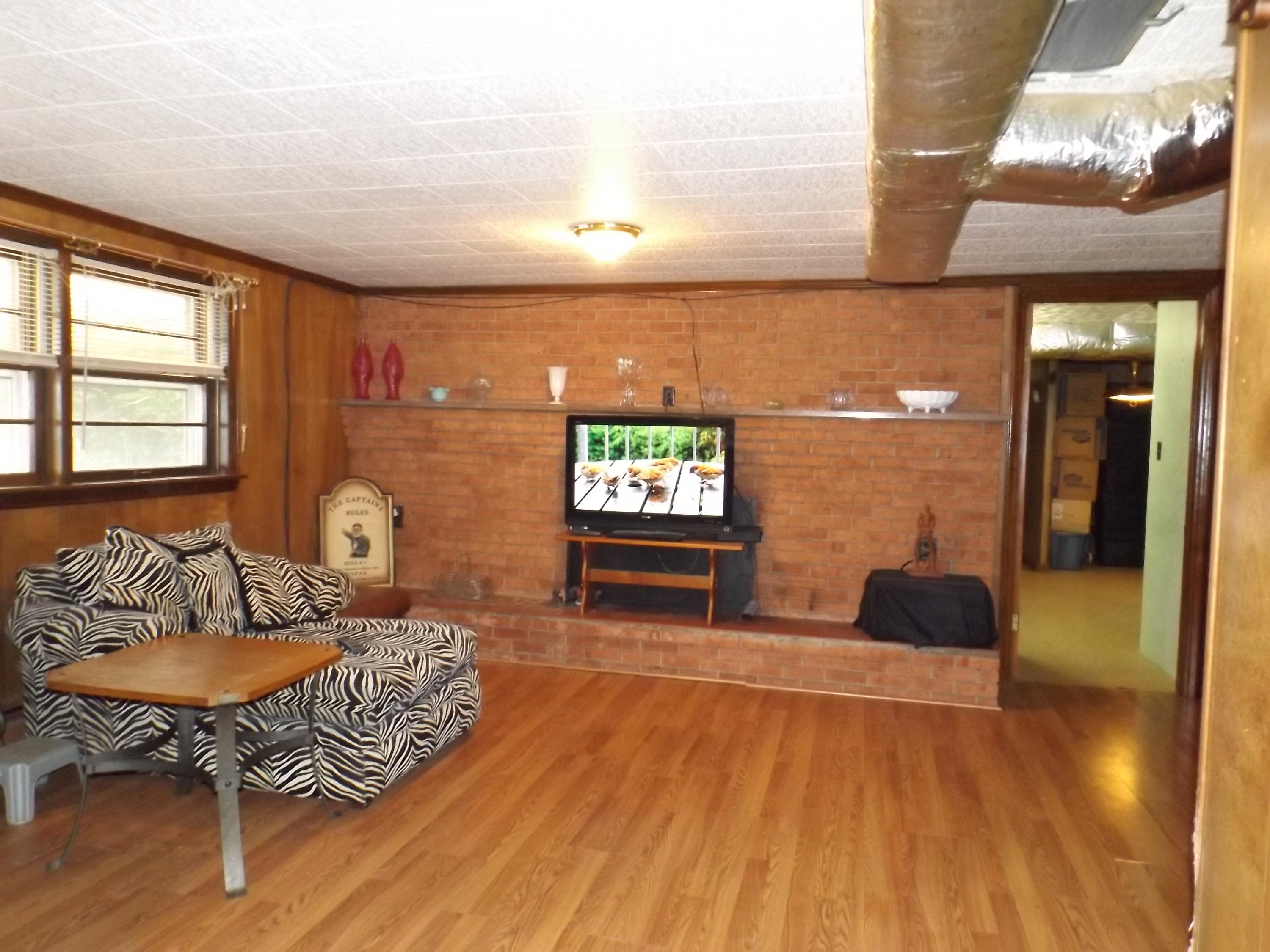 3147 Blue Ridge Boulevard Blue Ridge, VA 24064 - Photo 41 of 57 a living room with furniture and a wooden floor