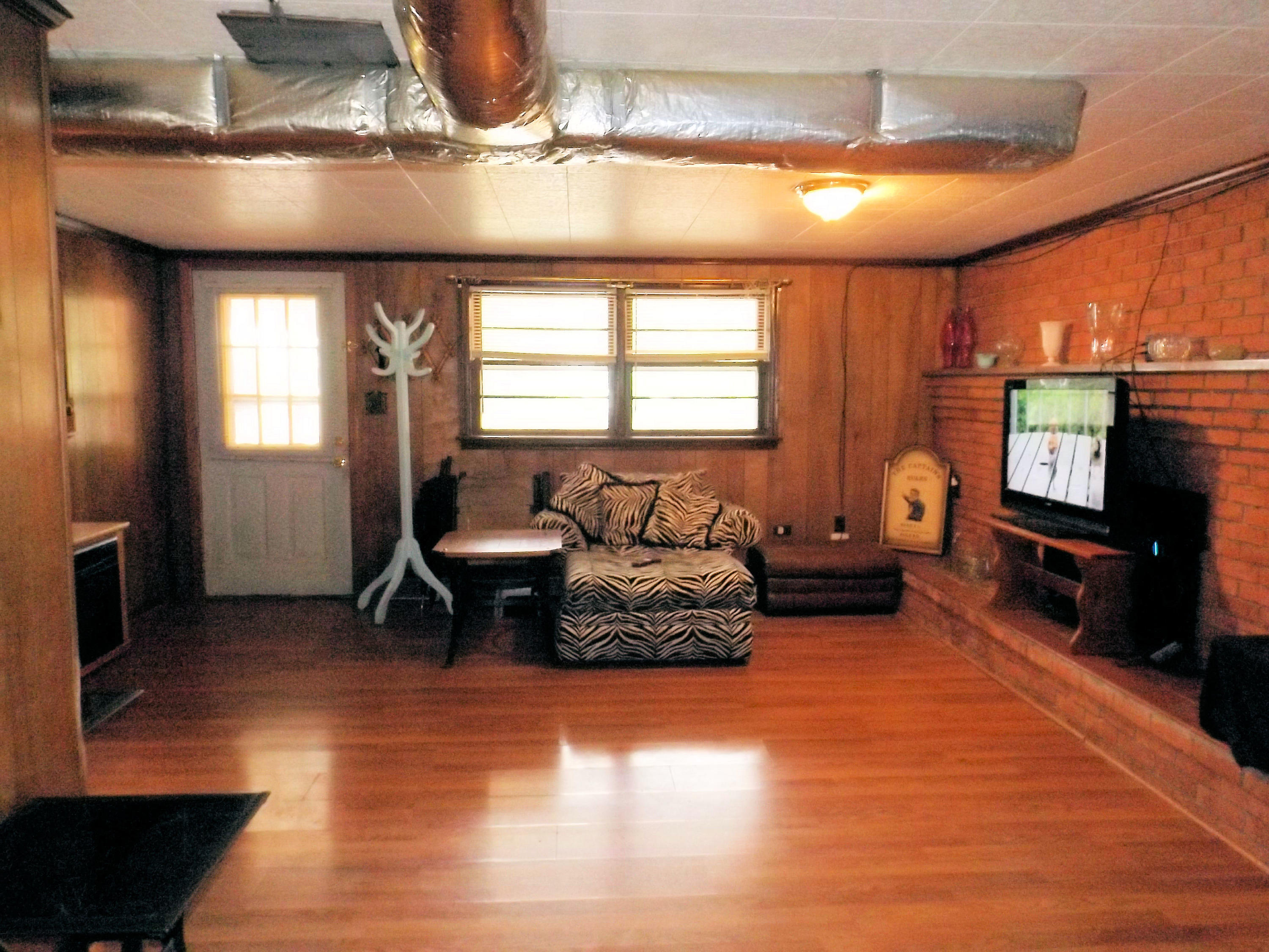 3147 Blue Ridge Boulevard Blue Ridge, VA 24064 - Photo 44 of 57 a living room with furniture and a flat screen tv