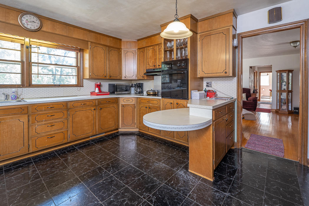 3147 Blue Ridge Boulevard Blue Ridge, VA 24064 - Photo 6 of 57 a open kitchen with stainless steel appliances granite countertop a sink a stove and a wooden floors