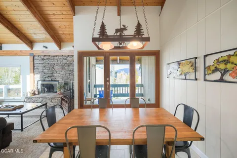 a view of a dining room with furniture window and outside view