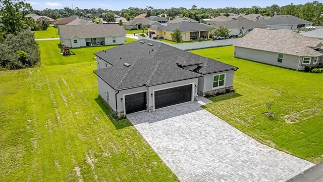 an aerial view of residential houses with swimming pool