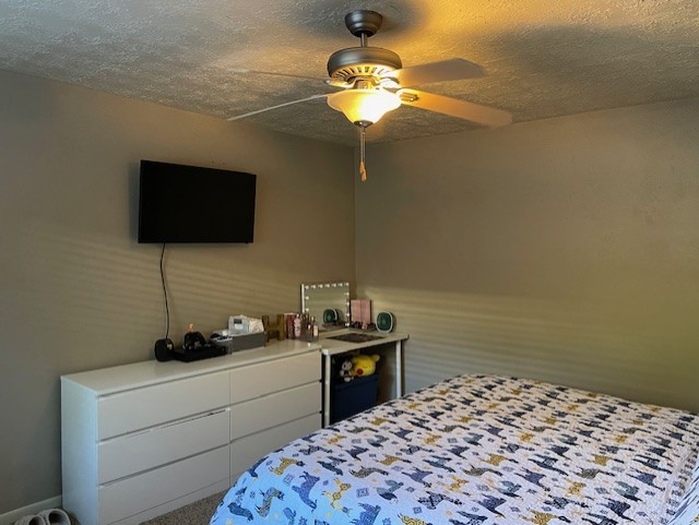 2426 Summer Spring Drive Spring, TX 77373 - Photo 14 of 24 a bedroom with a bed and a flat screen tv