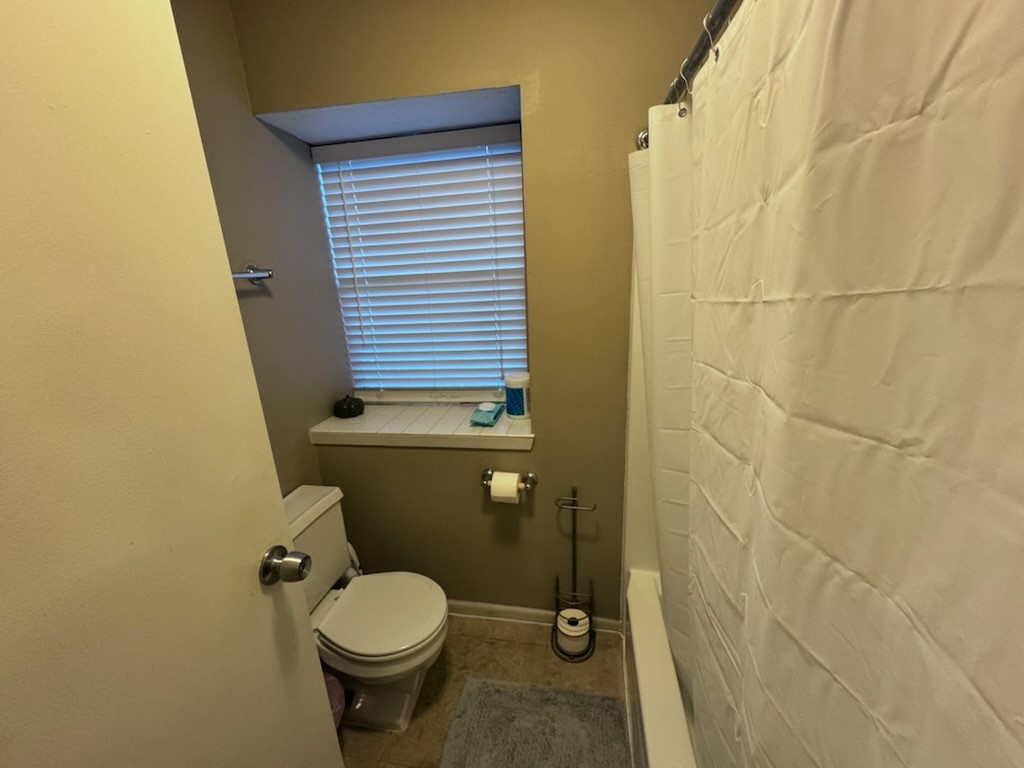 2426 Summer Spring Drive Spring, TX 77373 - Photo 20 of 24 a bathroom with a toilet and a shower