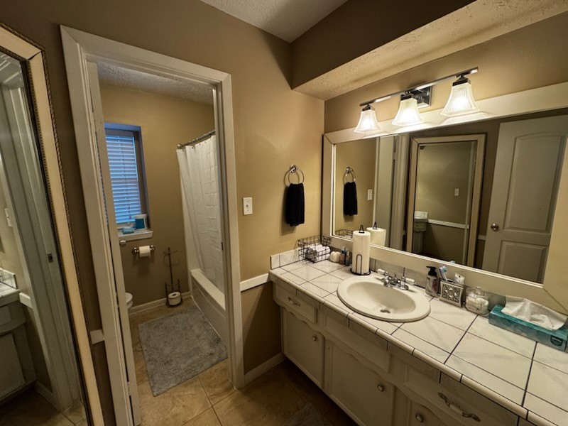 2426 Summer Spring Drive Spring, TX 77373 - Photo 21 of 24 a bathroom with a double vanity sink and a mirror