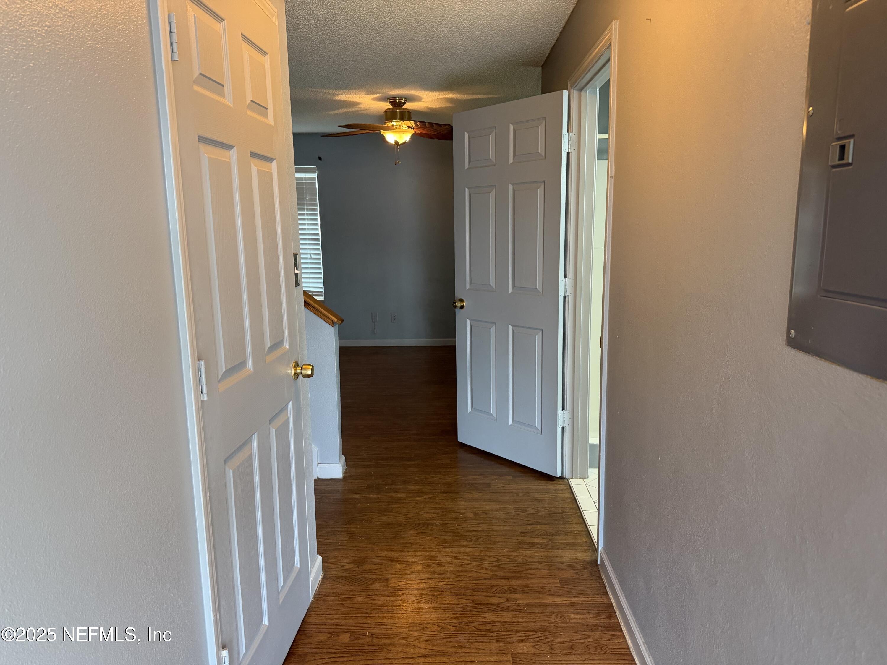 1114 Scheidel Court Atlantic Beach, FL 32233 - Photo 10 of 13 a view of a hallway with wooden floor