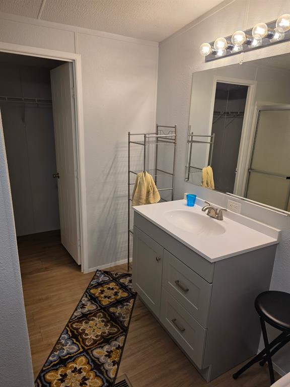 115 Yates Circle Aledo, TX 76008 - Photo 27 of 31 a bathroom with a sink and a mirror