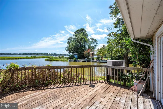 a view of a lake with houses in the back