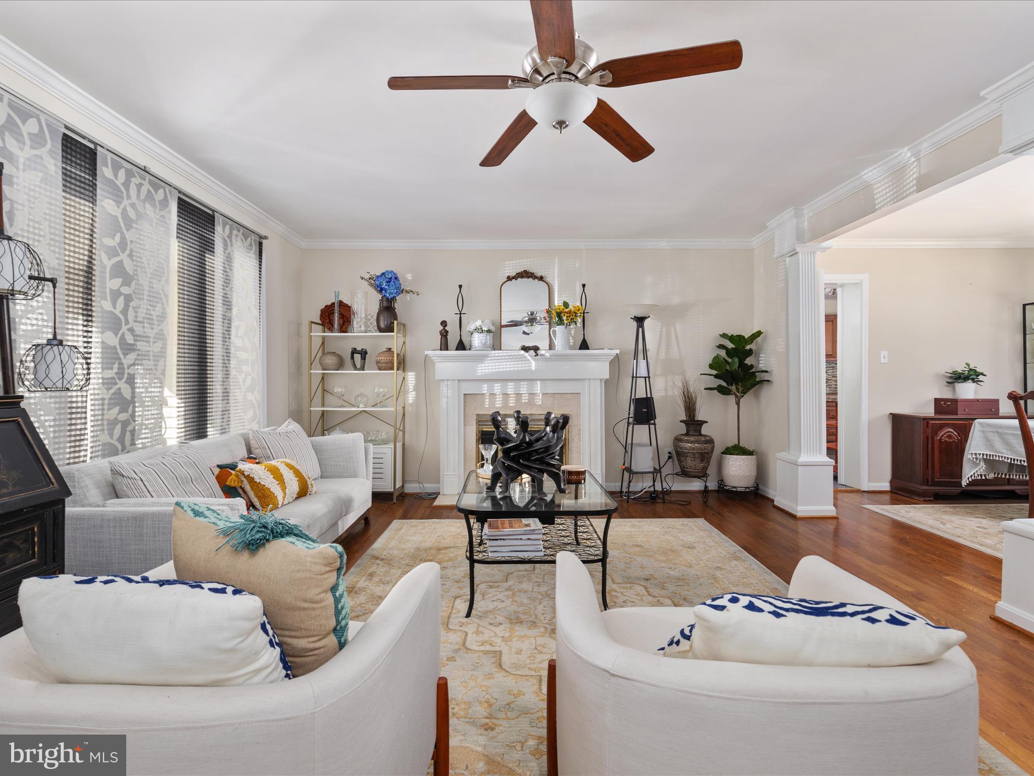 6806 Ruskin Street Springfield, VA 22150 - Photo 6 of 53 a living room with furniture and a chandelier
