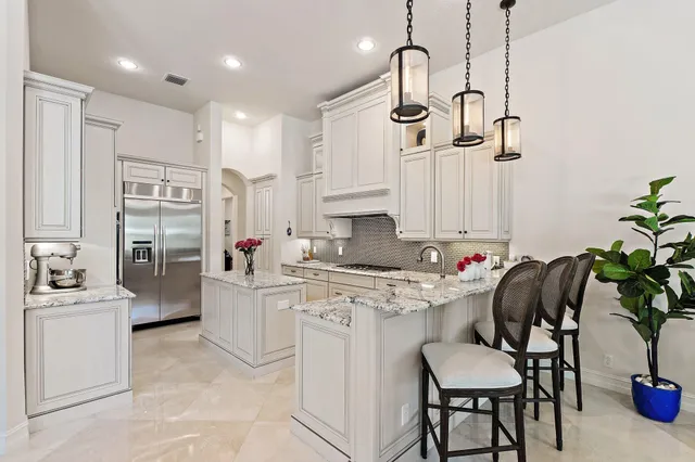 a view of a livingroom with furniture and a flat screen tv