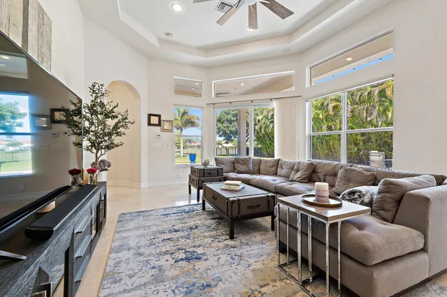 a view of a workspace with furniture and wooden floor