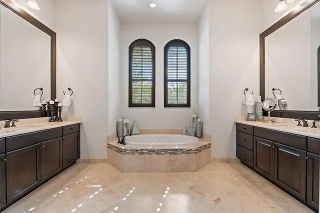 a view of a house with swimming pool and a yard