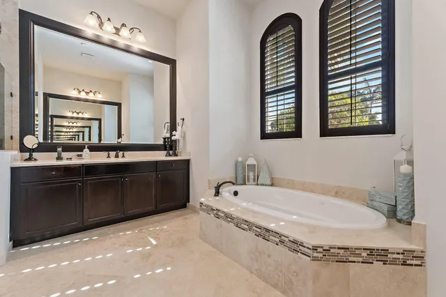 an aerial view of a house with an outdoor space