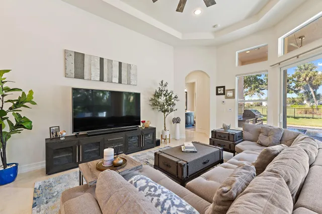 a kitchen with white cabinets and refrigerator