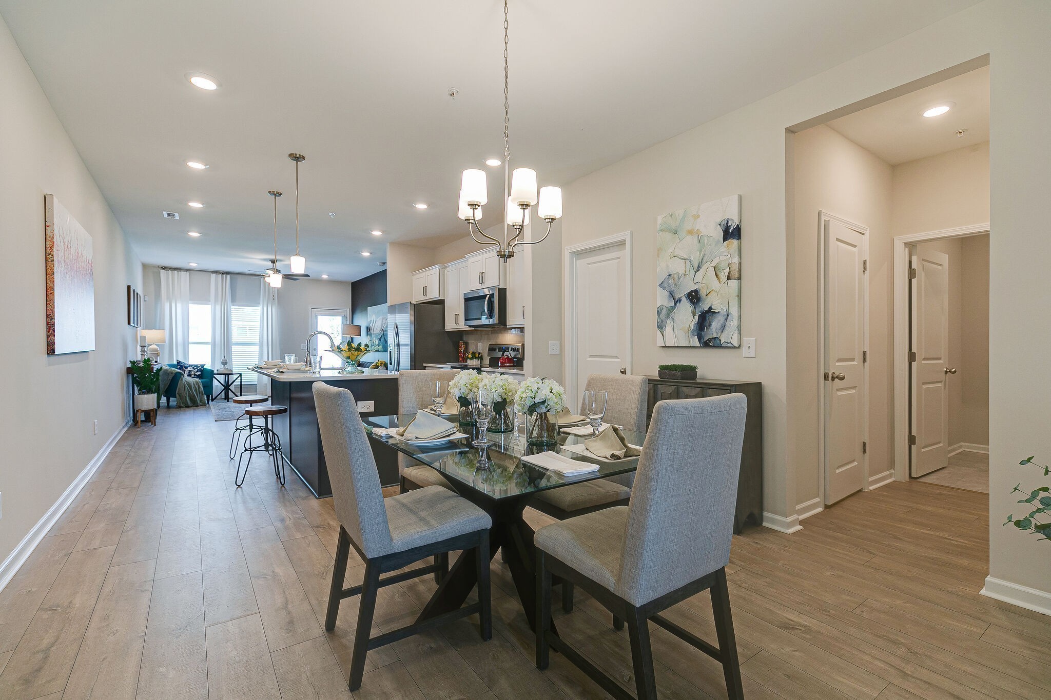1177 Short Street Spring Hill, TN 37174 - Photo 6 of 20 a view of a dining room and livingroom with furniture wooden floor a chandelier