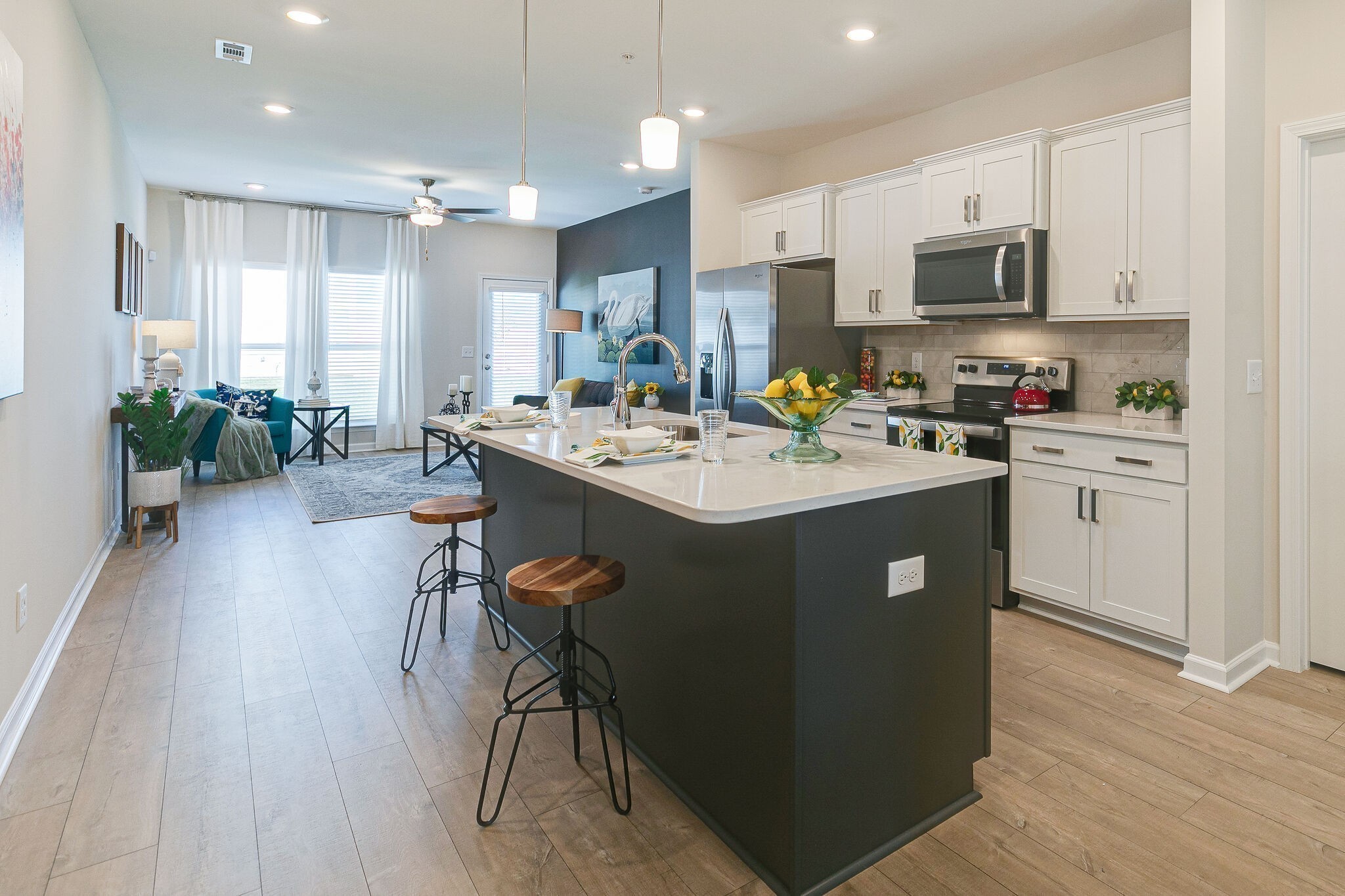 1177 Short Street Spring Hill, TN 37174 - Photo 8 of 20 a kitchen with a table chairs refrigerator and microwave