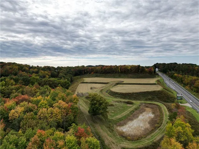 a view of a swimming pool with a yard