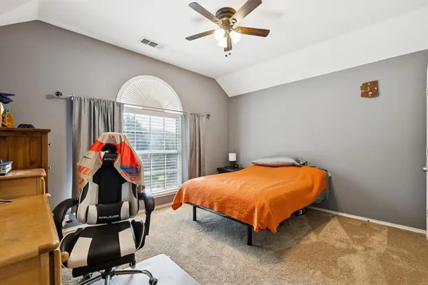 a room with a bed and a window