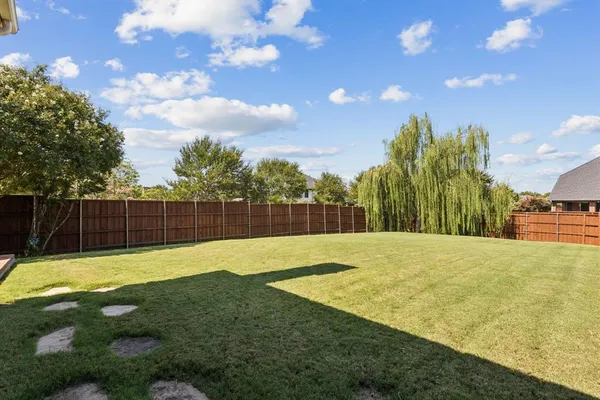 a swimming pool with wooden fence