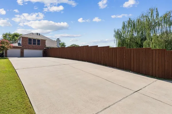 a terrace view with couple of cars parked