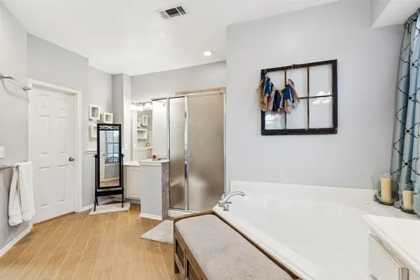 a bathroom with a tub and a sink