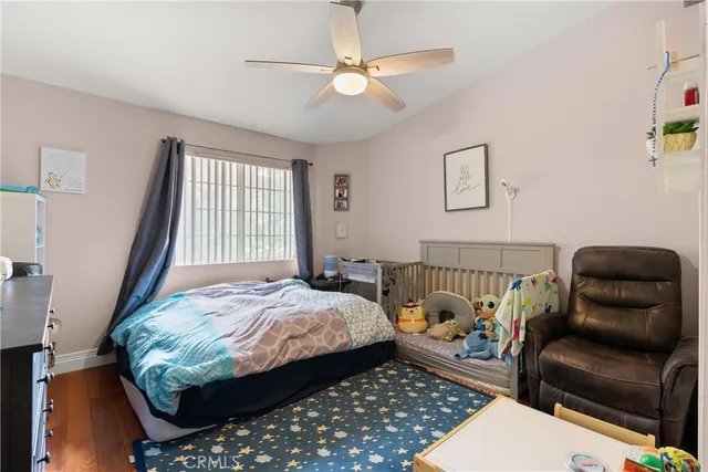 a bedroom with bed and a couch