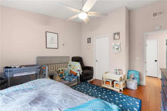 a bedroom with bed and a dresser