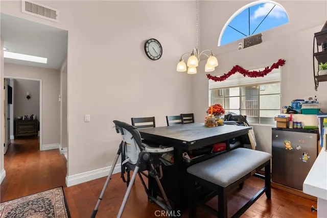 a view of a dining room and a table in it