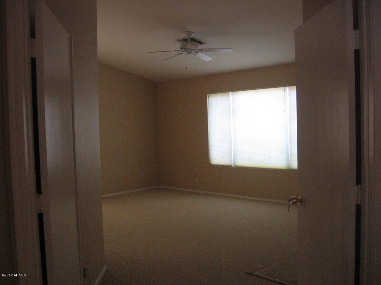 4017 East Agave Road Phoenix, AZ 85044 - Photo 13 of 18 Master bedroom w/double door entry