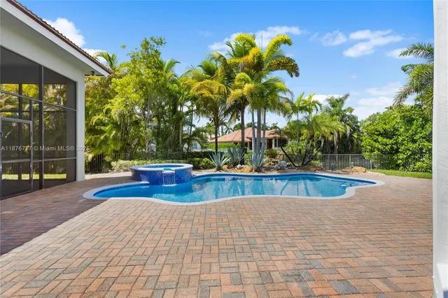 a view of swimming pool with a patio