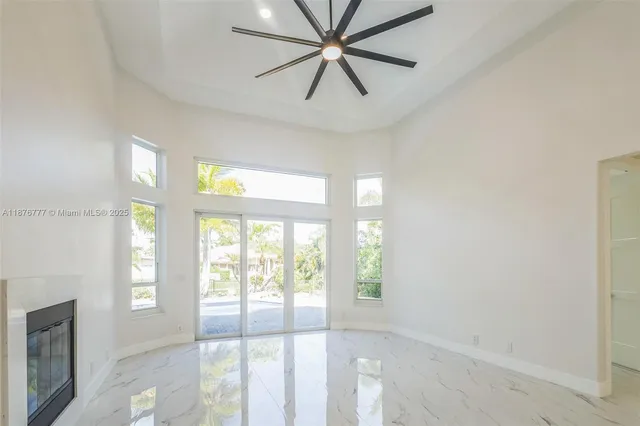 a view of room with window and ceiling fan