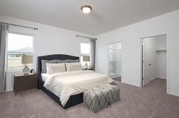 a bedroom with a bed and a couch