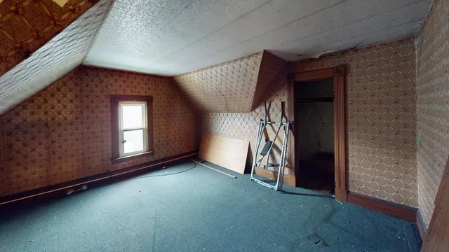 a view of empty room with ceiling fan