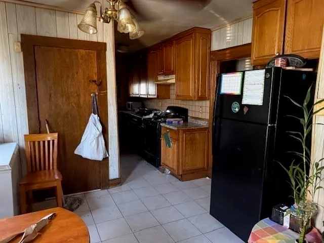 a bathroom with mirror and shower