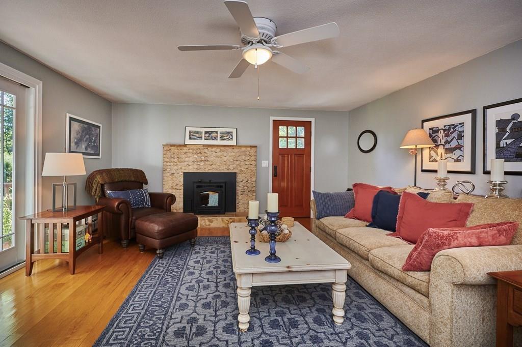 302 Loudville Road Easthampton, MA 01027 - Photo 12 of 34 a living room with furniture a fireplace and a flat screen tv