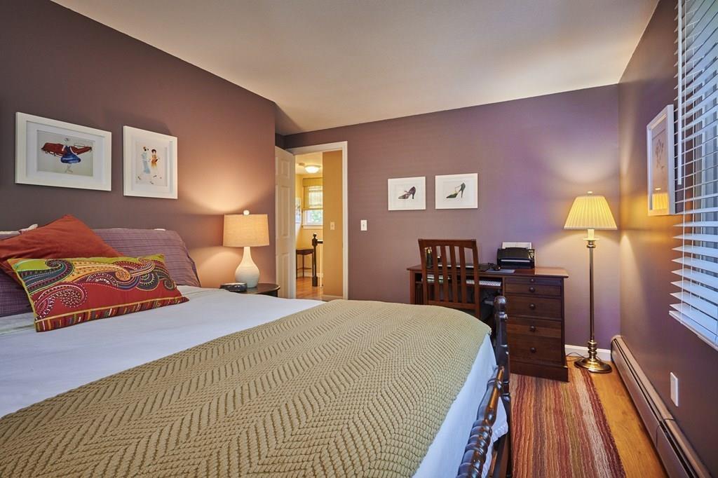 302 Loudville Road Easthampton, MA 01027 - Photo 20 of 34 a bedroom with a bed and wooden floor