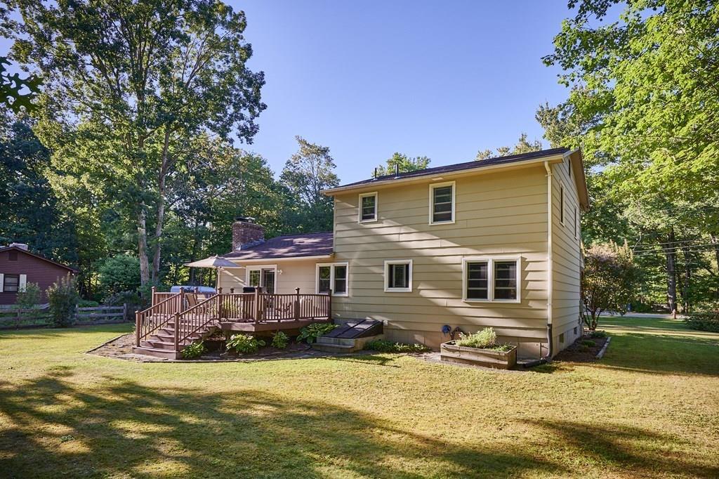 302 Loudville Road Easthampton, MA 01027 - Photo 30 of 34 a front view of house with yard and trees in the background
