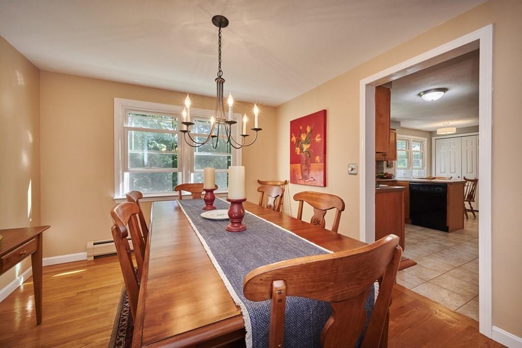 302 Loudville Road Easthampton, MA 01027 - Photo 7 of 34 a view of a dining room and livingroom with furniture wooden floor a chandelier