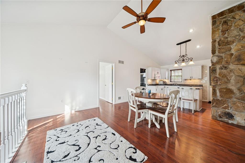 1512 Abers Creek Road Pittsburgh, PA 15239 - Photo 11 of 45 a view of a dining room with furniture and wooden floor