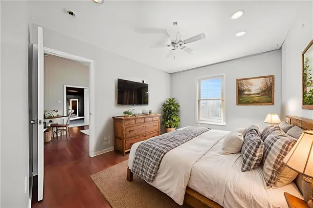 a bedroom with a bed and a window