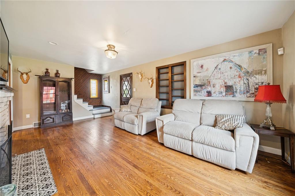 1512 Abers Creek Road Pittsburgh, PA 15239 - Photo 19 of 45 a living room with furniture and wooden floor