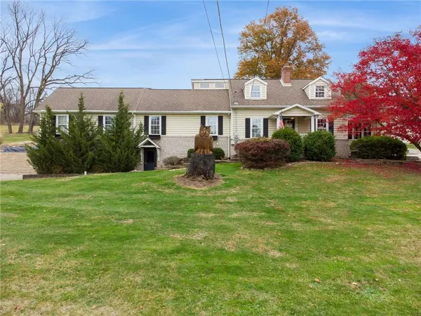 a front view of a house with garden