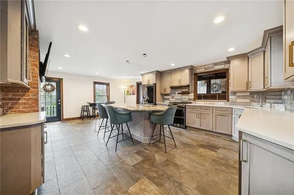 a kitchen with a sink cabinets and window