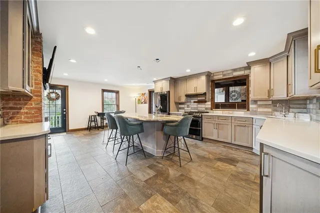 a kitchen with a sink cabinets and window