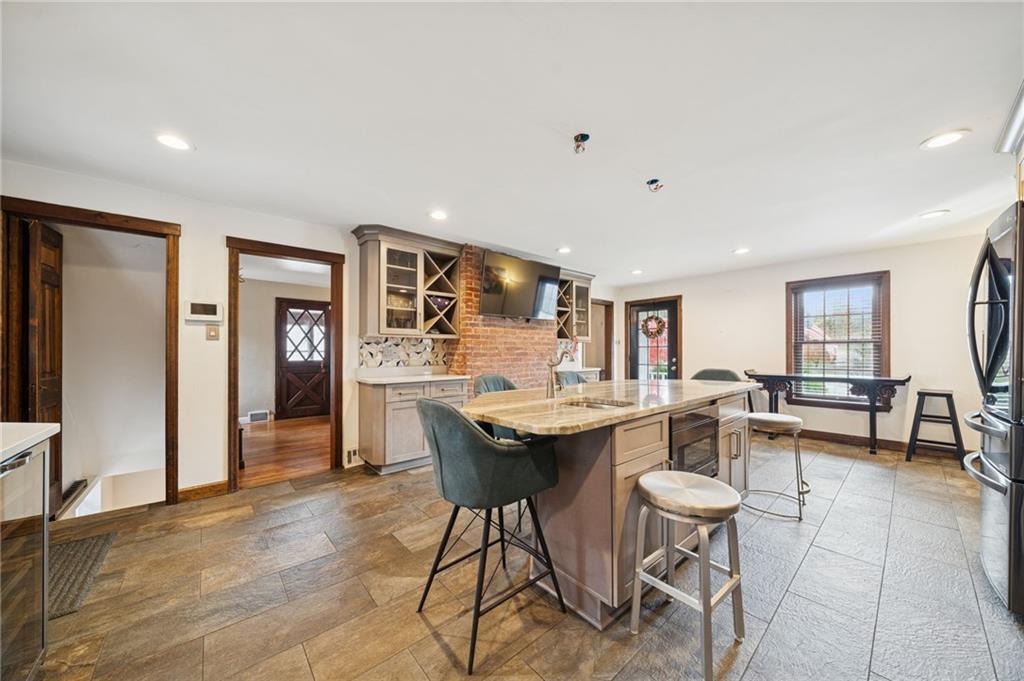 1512 Abers Creek Road Pittsburgh, PA 15239 - Photo 5 of 45 a kitchen with a table and chairs in it