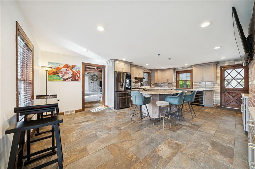 1512 Abers Creek Road Pittsburgh, PA 15239 - Photo 6 of 45 a living room with lots of furniture and kitchen view