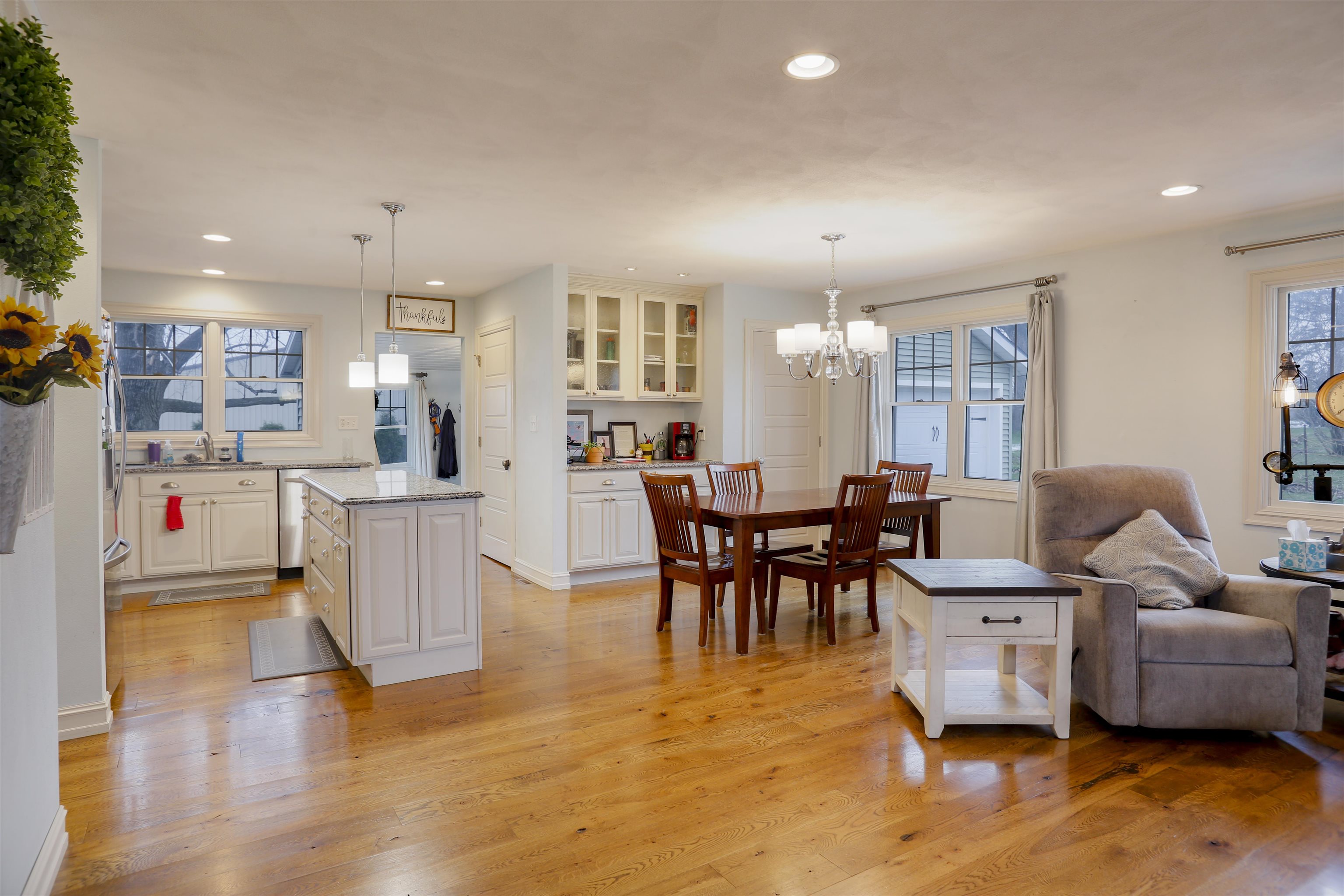 616 Davis Street Davis, IL 61019 - Photo 2 of 14 a living room with furniture and a dining table with kitchen view