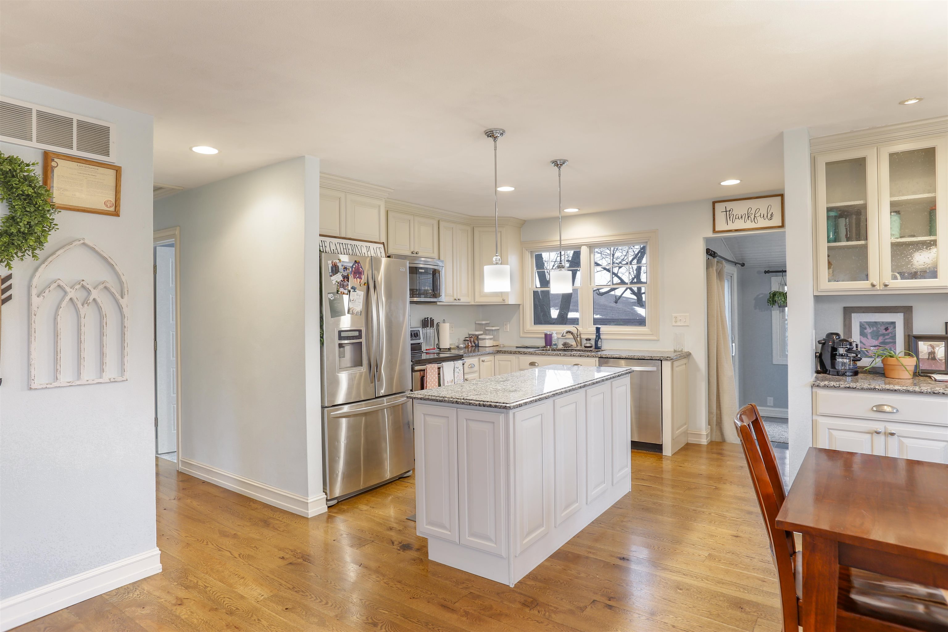 616 Davis Street Davis, IL 61019 - Photo 4 of 14 a kitchen with stainless steel appliances granite countertop a refrigerator and a sink