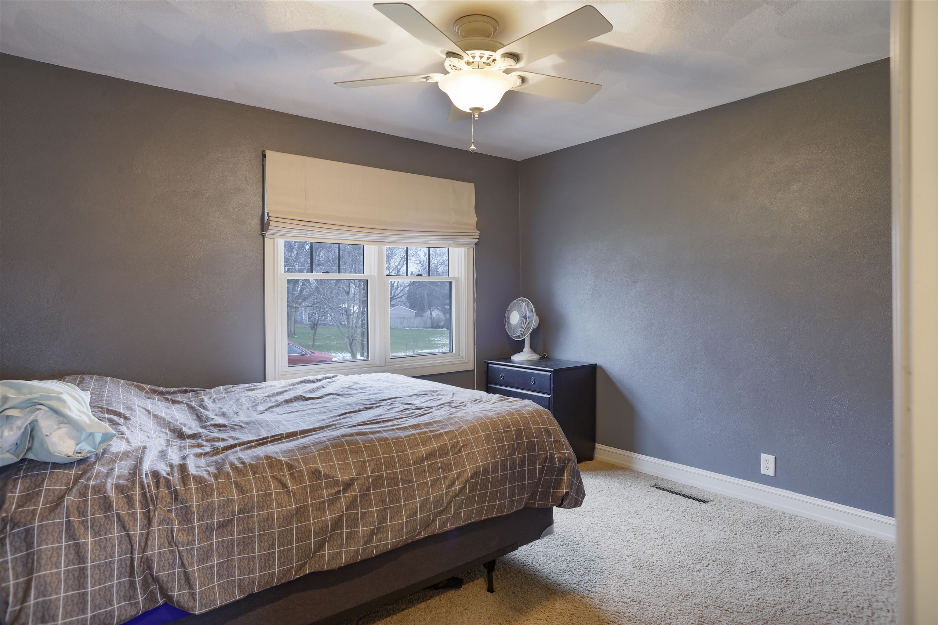 616 Davis Street Davis, IL 61019 - Photo 7 of 14 a bedroom with a bed and window