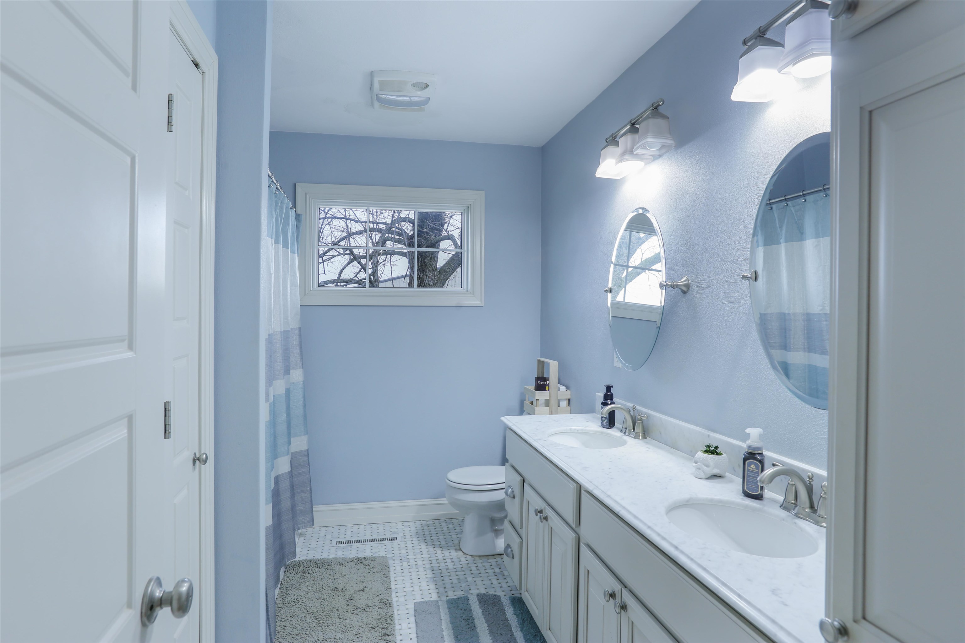 616 Davis Street Davis, IL 61019 - Photo 9 of 14 a bathroom with a sink a toilet and a mirror