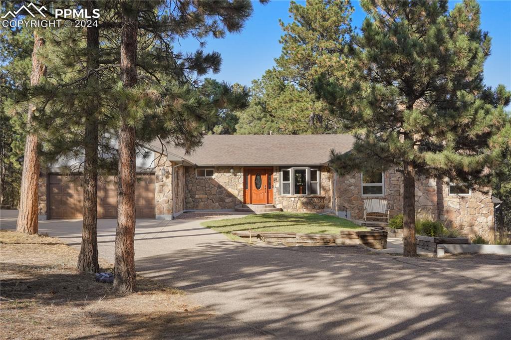 9450 Morgan Road Colorado Springs, CO 80908 - Photo 1 of 49 a front view of a house with a yard
